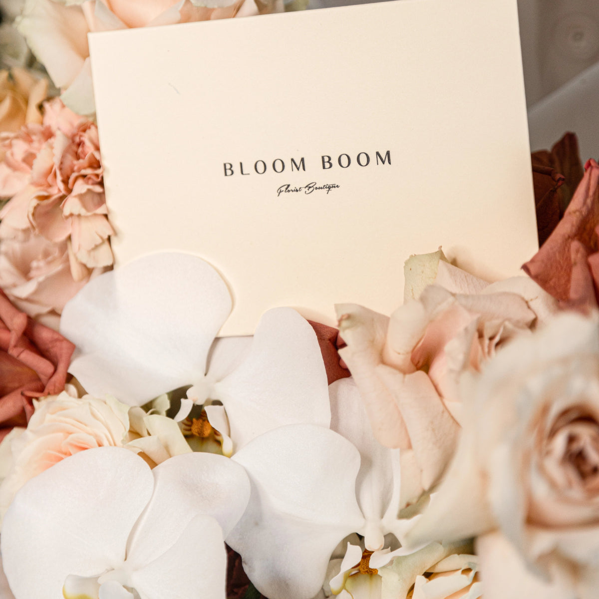 Bloom Boom Florist Boutique cream gift box with white hydrangeas and blush pink roses floral arrangement