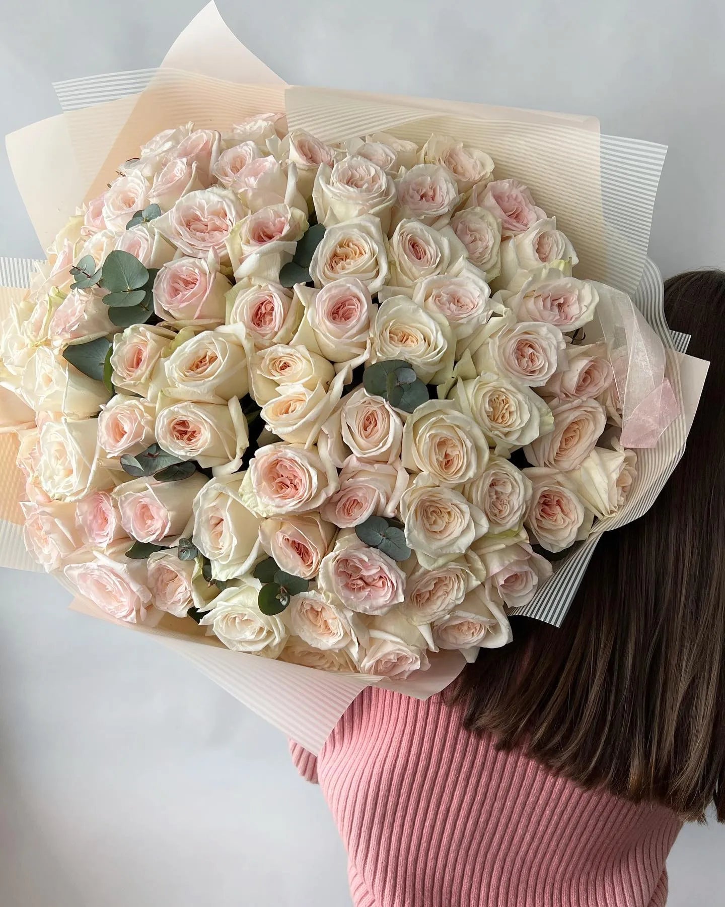 Luxury blush pink and cream rose bouquet with eucalyptus in neutral paper wrapping, premium flower delivery Los Angeles