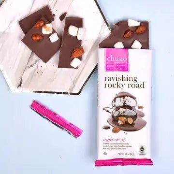 Chuao Rocky Road chocolate bar with marshmallows and almonds, showing packaging and broken pieces