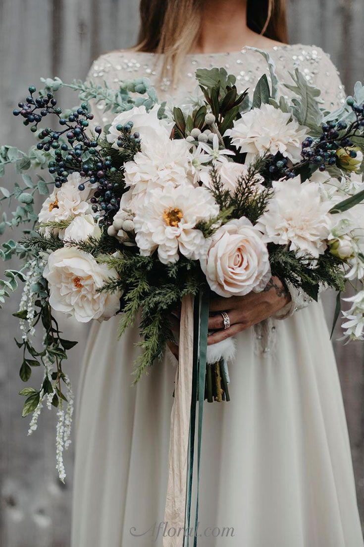 Bridal bouquet with garden roses and viburnum berries