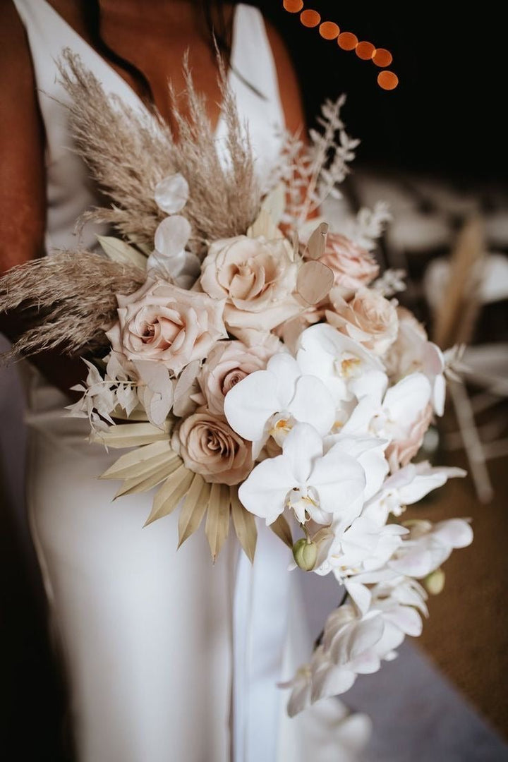 Bridal bouquet with pampas dried palm roses and orchid