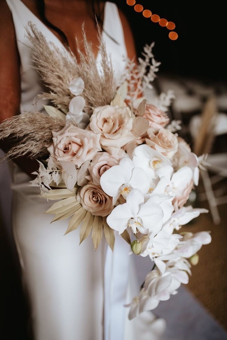 Bridal bouquet with pampas dried palm roses and orchid