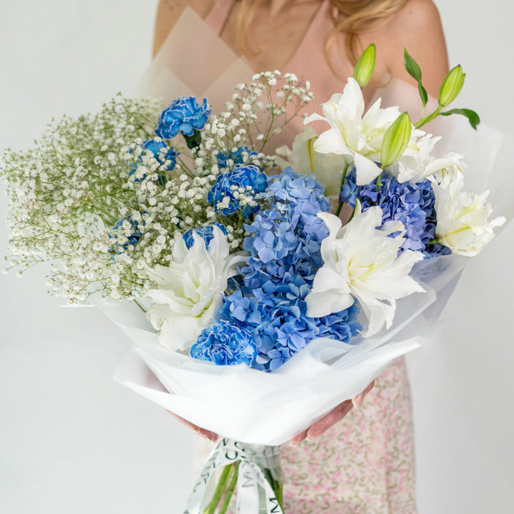 Bouquet "Emerald Enchantment" with lily and gypsophila