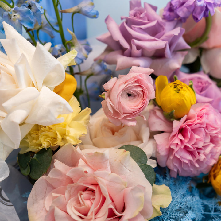 Simple bouquet "Rainbow" with roses and delphinium