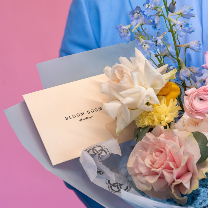 Simple bouquet "Rainbow" with roses and delphinium