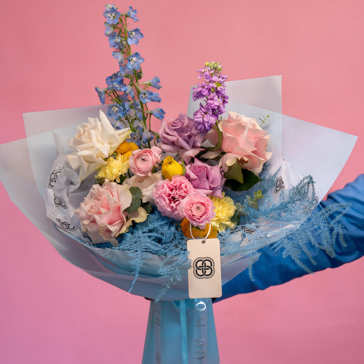 Simple bouquet "Rainbow" with roses and delphinium