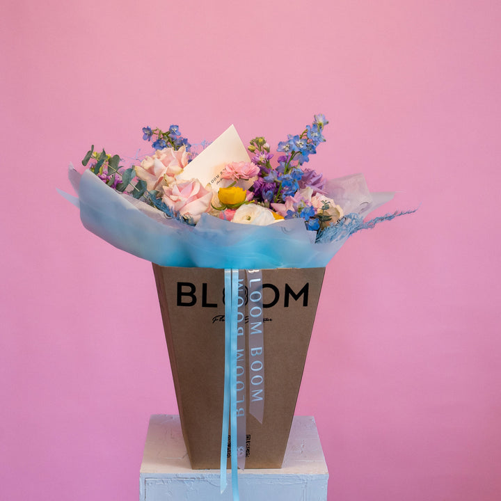 Small "Rainbow" bouquet with roses and delphinium