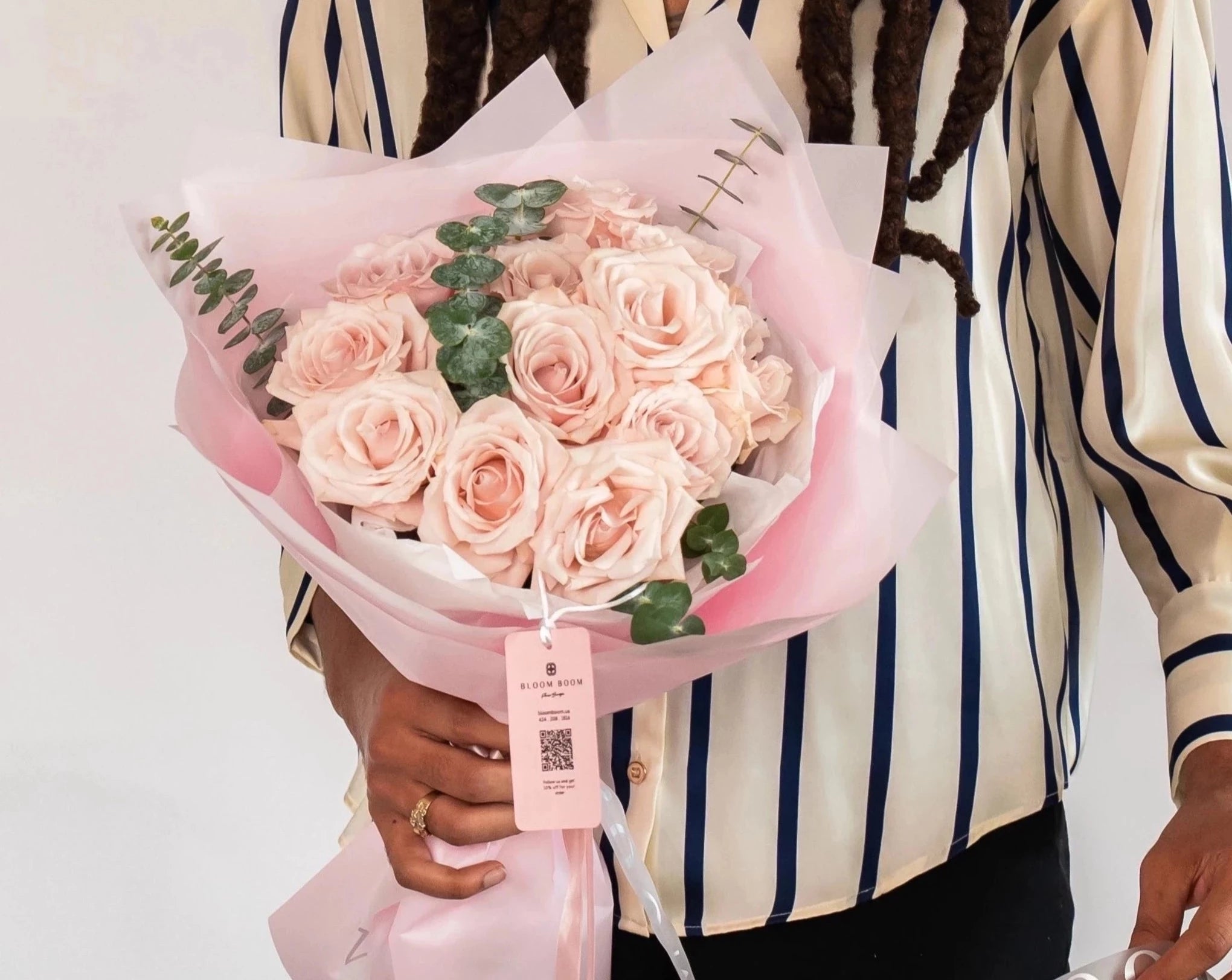 Blush pink rose bouquet with eucalyptus wrapped in pink paper, featuring 12 premium roses from Bloom Boom Flowers LA