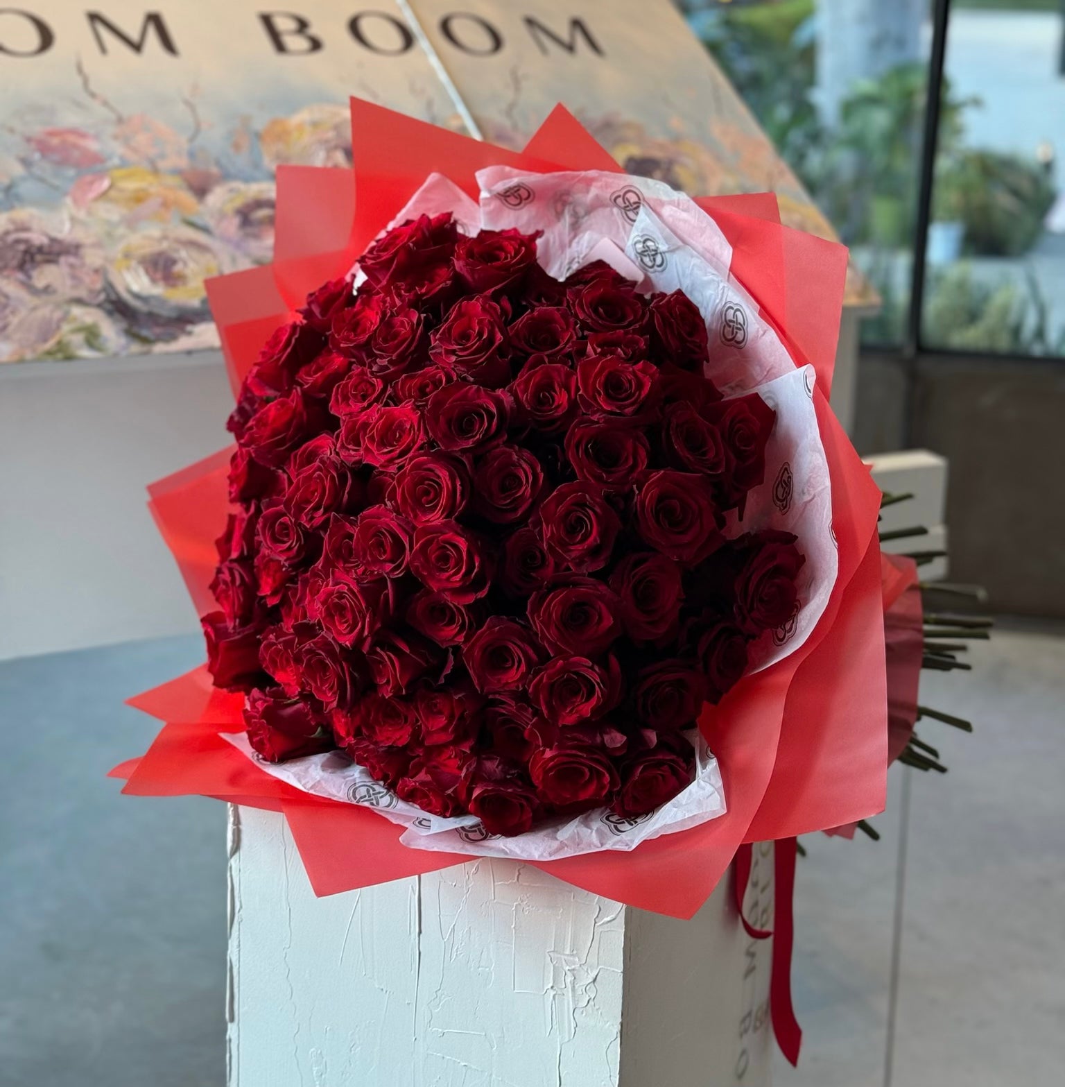 Deep red roses bouquet wrapped in red paper - premium romantic flower arrangement from Bloom Boom Flowers LA