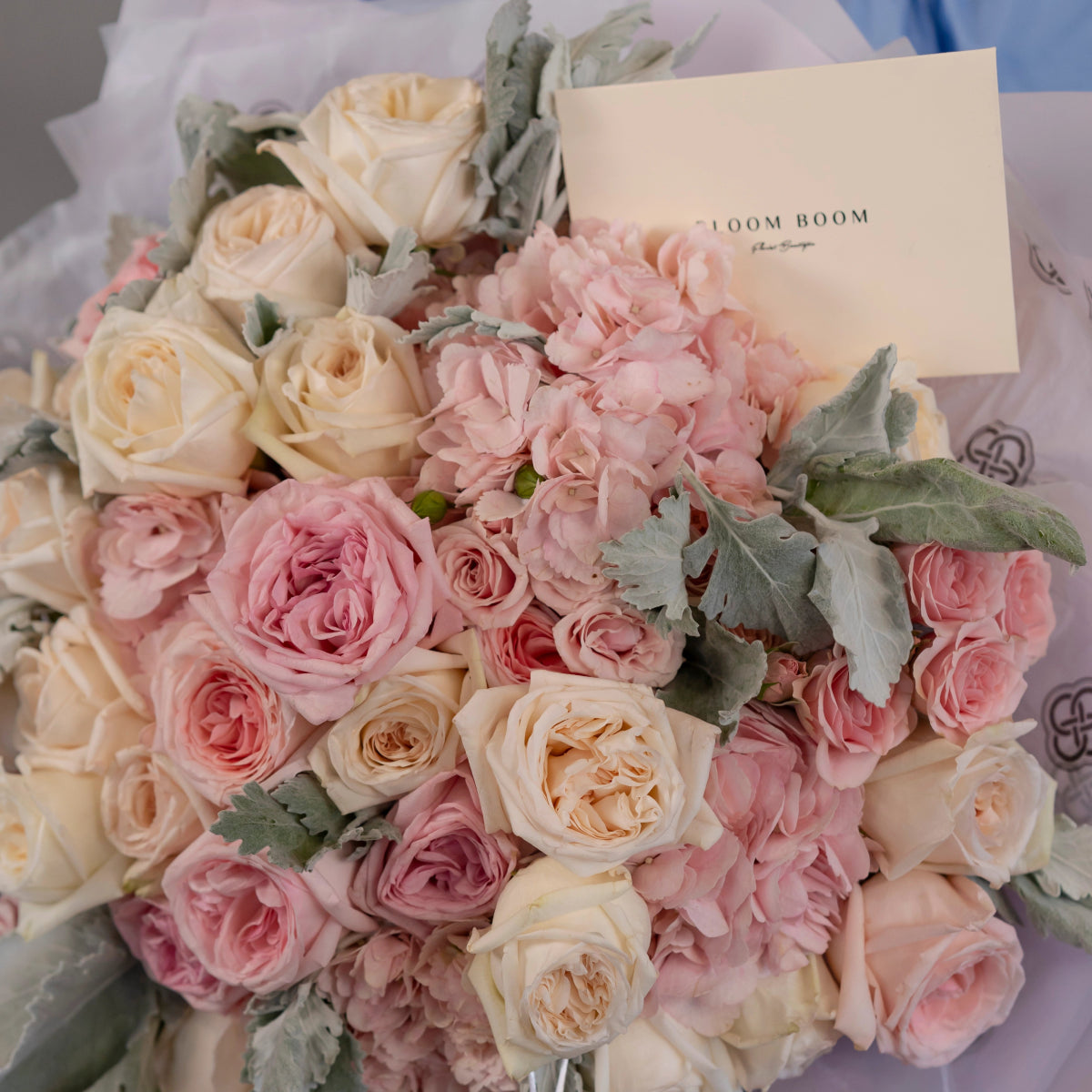 Luxury flower bouquet with blush pink roses, cream roses, pink hydrangea and dusty miller leaves with gift card
