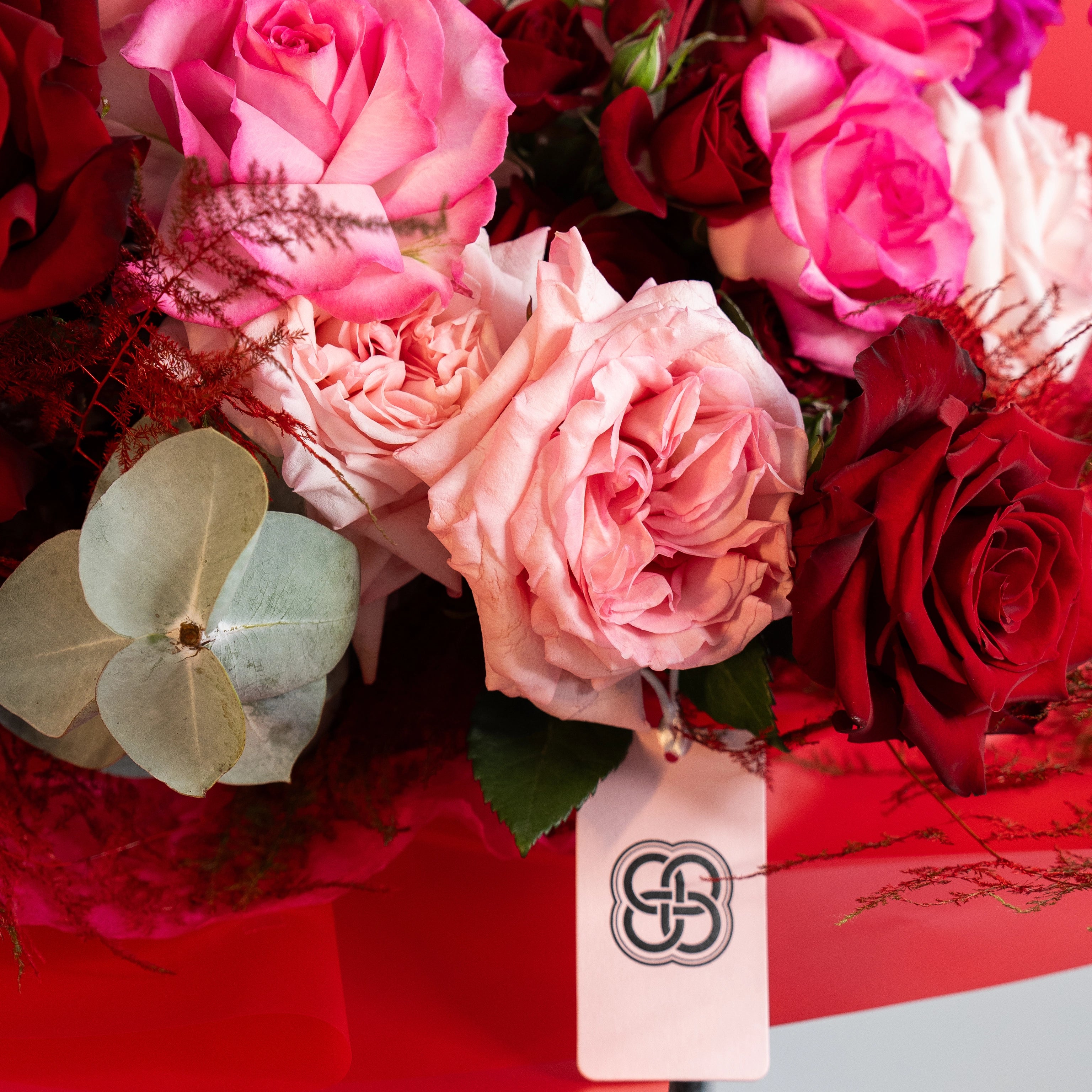 Pink and red rose bouquet with eucalyptus in elegant red gift box - premium flower delivery Los Angeles