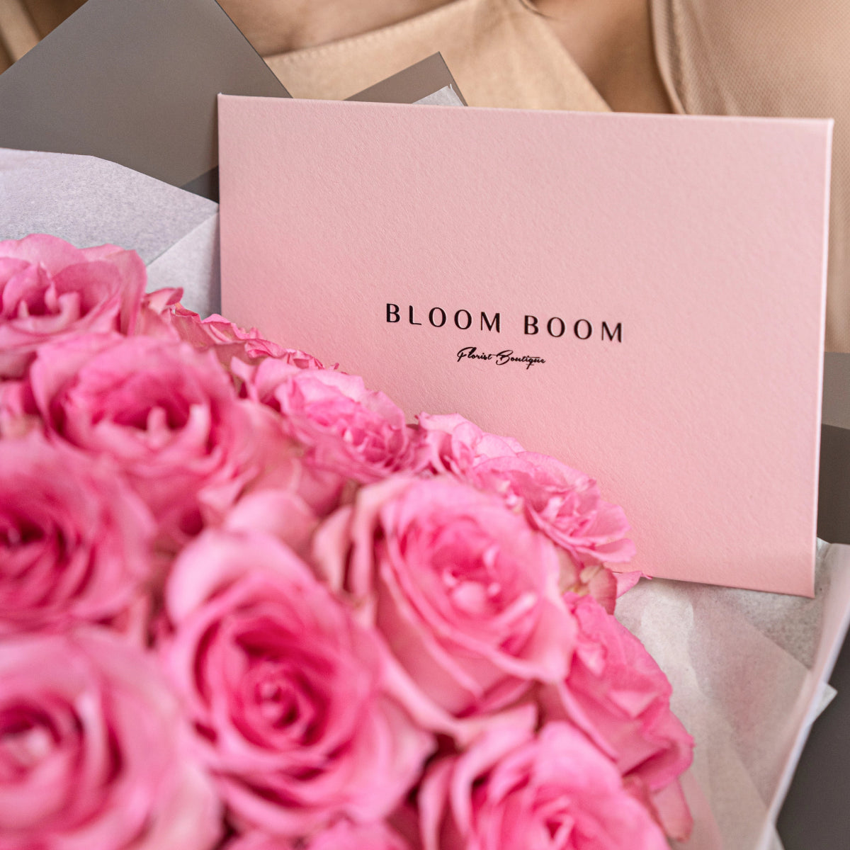 Pink rose bouquet with Bloom Boom Flower Boutique branded packaging and gift wrapping